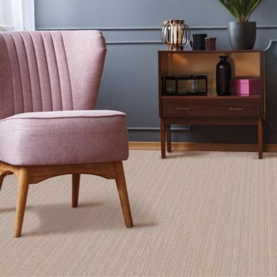 beige carpets in a classy Irvine living room with pink chair